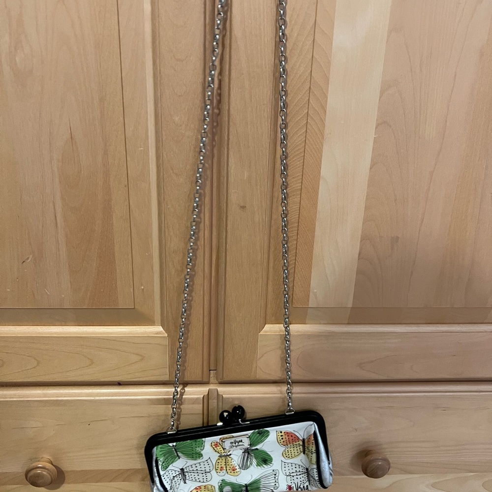 White Brighton clutch bag with butterfly’s